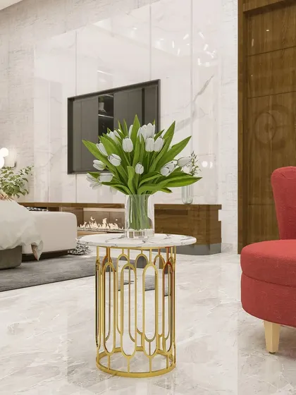 A detail shot of the luxurious seating area, highlighting the elegant gold and marble side table.