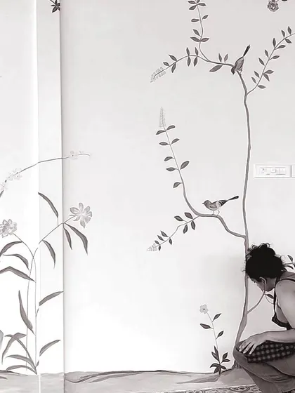 Another angle of me working on the detailed French mural, focusing on the lower sections of the wall.