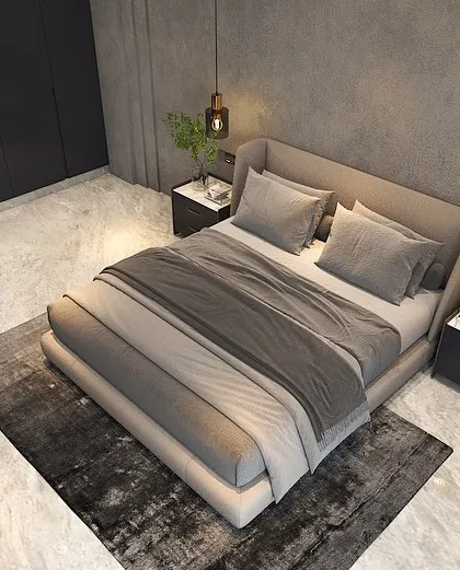 An overhead view of the bedroom, showing the spacious layout, plush rug, and the contrast between the cool grey tones and warm wooden elements.