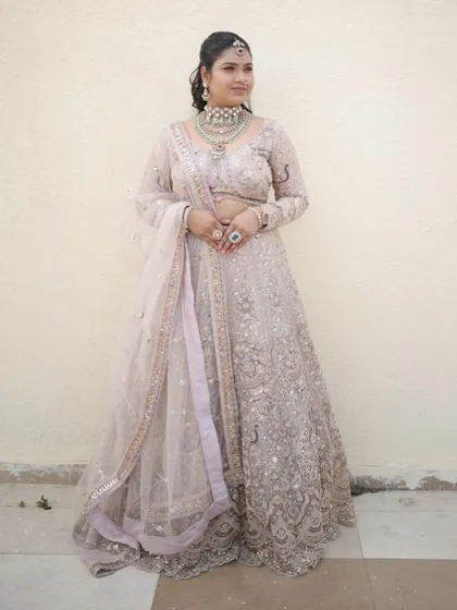A simple and elegant full-length shot, perfect for showing how the lehenga looks in natural light.
