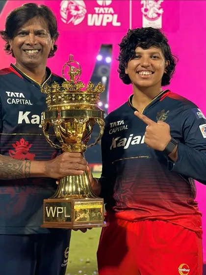 With a player and the WPL trophy. My goal is to empower every player to reach their full potential and shine bright.
