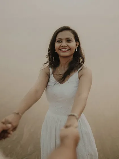 Your hand in mine is my favorite place to be. A beautiful point-of-view shot that makes you feel like you're part of their love story during this beach pre-wedding session.
