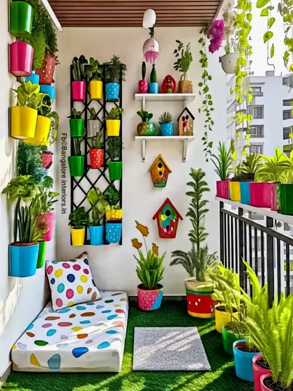 A vibrant and colorful balcony design with a rainbow of planters and a polka-dot mattress. This cheerful setup with birdhouses and artificial grass creates a playful and inviting outdoor space.