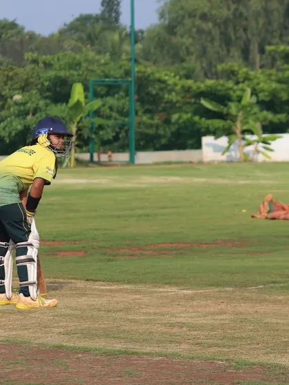 A batter takes her stance at the crease, ready to face the bowler on our expansive outfield.