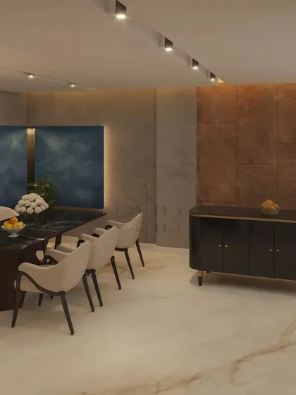 This view shows the open-plan dining and living area, where a black credenza and a dark dining table anchor the space.