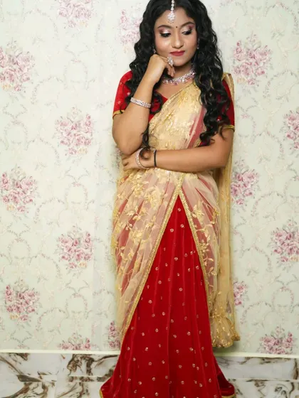 A full view of the simple red lehenga, showing its floor-length skirt and elegant drape.