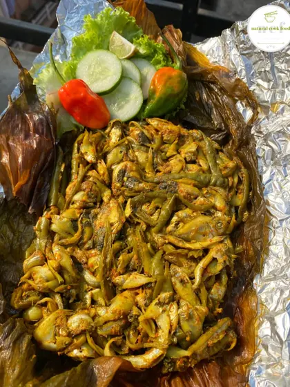 My chef's special Nganam, which is a preparation of small fish steamed in aromatic turmeric leaves.