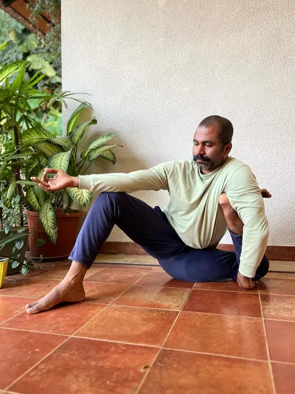 This series shows the preparatory poses for Yoga Dandasana, including variations of Ardha Matsyendrasana, Eka Pada Rajakapotasana, and Baddha Virabhadrasana. It highlights the importance of preparing the body with twists and hip openers.