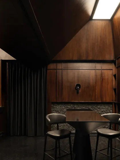 A collection of atmospheric shots from Lair, showcasing the interplay of black concrete, glass blocks, polished steel, and dramatic lighting. Each image captures a fragment of the bar's mysterious and immersive character.