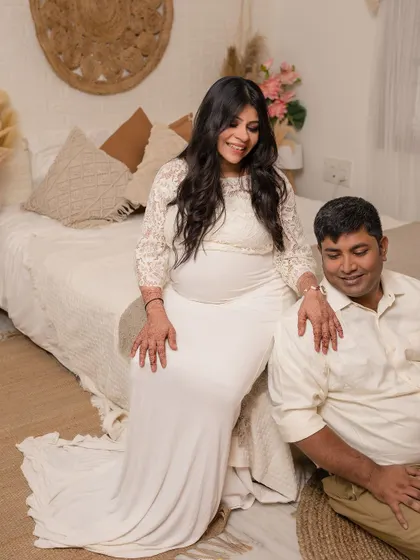 A cozy and intimate maternity portrait in our boho-chic bedroom set.
