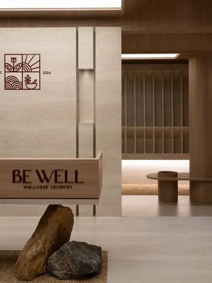 Further images from the BeWell, QBF Coffee, and Tubu projects, illustrating the consistent use of natural materials, clean lines, and thoughtful lighting to create serene and restorative commercial spaces.