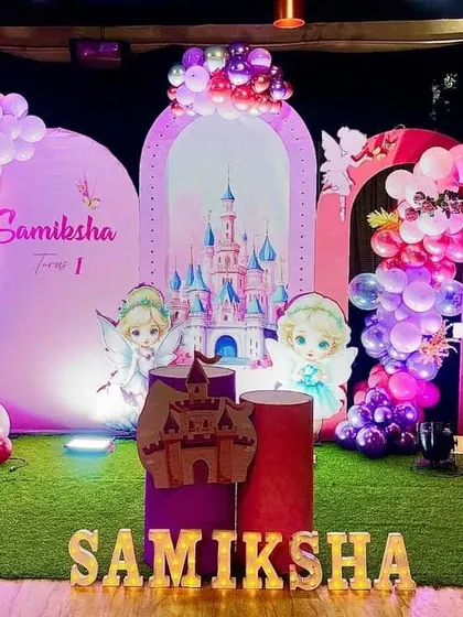 A different view of the fairytale castle theme, showing the placement of character cutouts and cake stands, creating a complete magical scene.