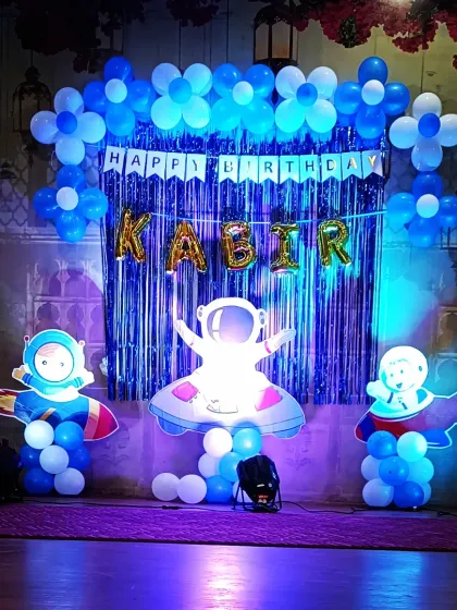 For a child who dreams of the stars, I created this out-of-this-world space theme. The setup for Kabir's birthday included astronaut cutouts, a galaxy-inspired balloon arrangement, and a shimmering blue backdrop to give the feel of a real space mission.