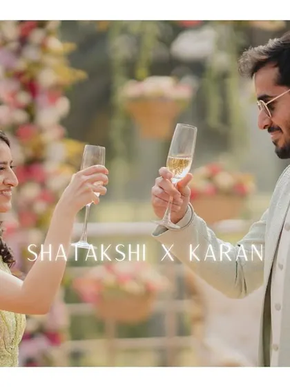 A toast to new beginnings. The couple raises their champagne glasses, celebrating their engagement with smiles and joy.