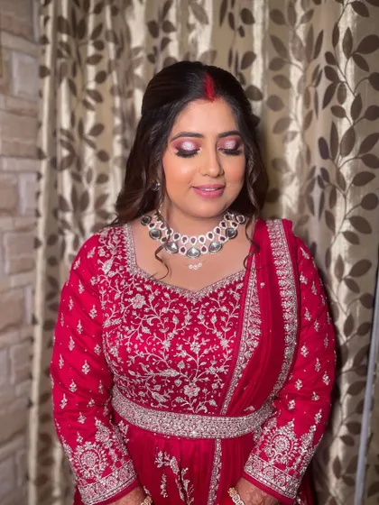 A close-up of the reception look, showing the dramatic pink and black smokey eye.