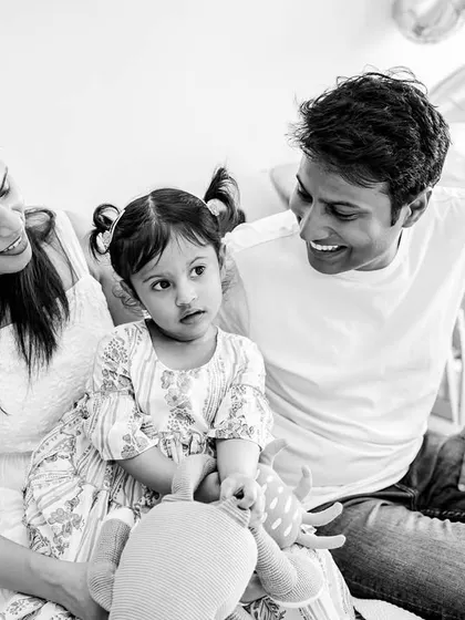 A happy family moment captured in timeless black and white. These candid shots are perfect for showing the laughter and fun of celebrating a second birthday at home.