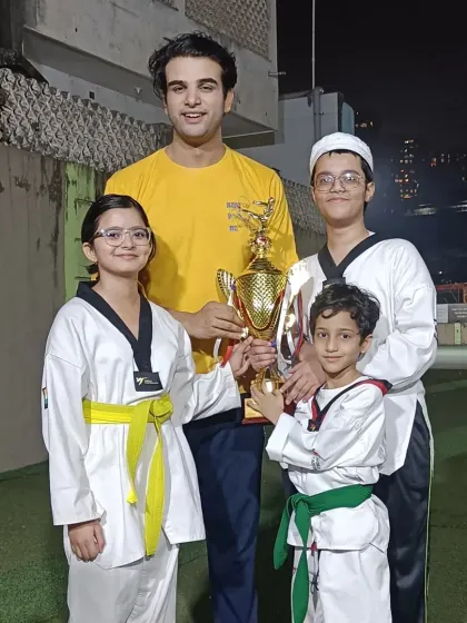Posing with some of my students and their trophy. I am so proud of what they have accomplished.