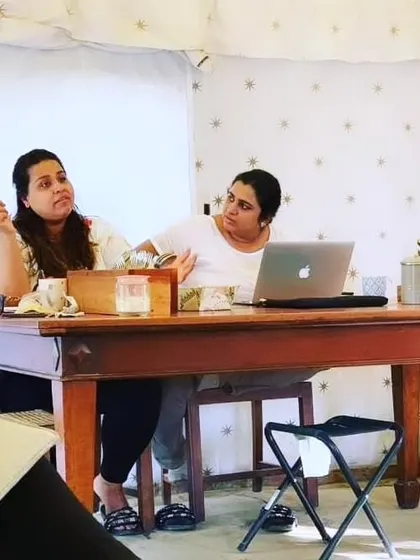 A behind-the-scenes shot of our founders, Khyati and Pooja, during a work session. This image captures the dedication and collaboration that goes into planning every event.