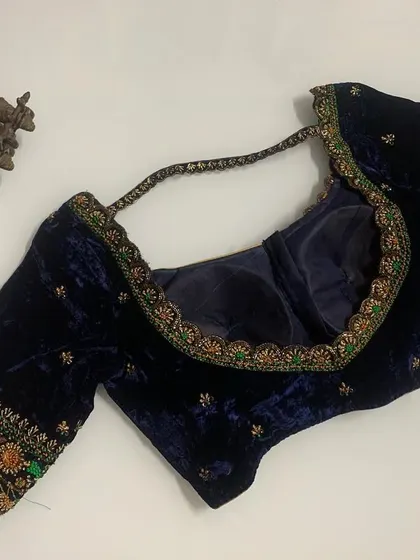A beautiful navy blue velvet blouse. I used multi-colored thread for the embroidery on the sleeve cuffs, adding a pop of unexpected color.