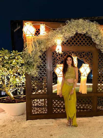 Pre-gig shot in a stunning lime green outfit for a Diwali party. I love bringing firecracker energy to festive events.