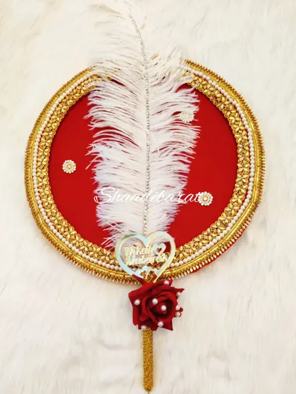 A simple yet elegant Nikah platter featuring a red velvet base, a decorative feather, and a custom pen. This can be used to present the pen during the ceremony.