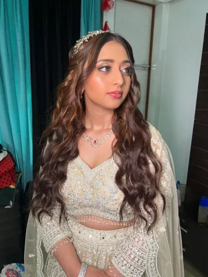 Shivani's engagement night glam. We went for beachy waves, a beautiful hair accessory, and a stunning bronze smokey eye.