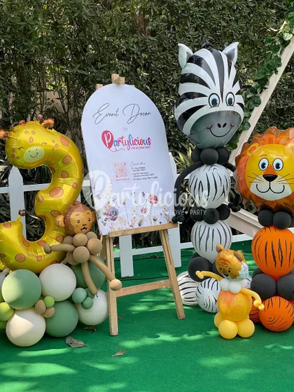 Our booth at the Jungly Wellness Festival, showcasing our event decor services with adorable balloon animal sculptures.