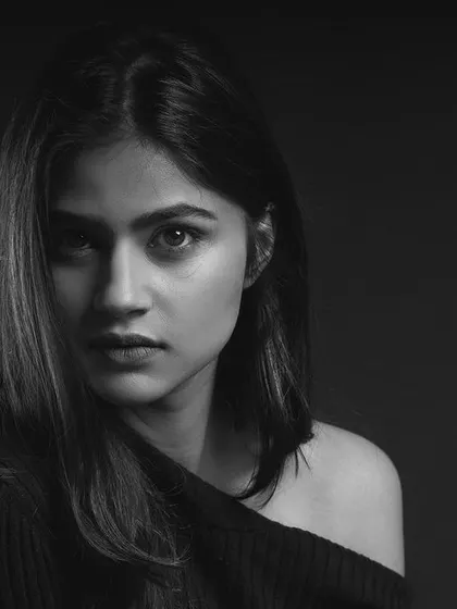 A strong, direct black and white portrait for a model's portfolio. I use dramatic studio lighting to strip away distractions, focusing on raw emotion and confident presence.