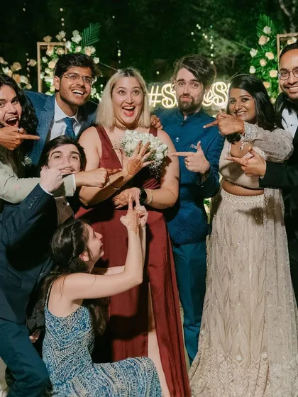 The newly engaged couple celebrating with the bride and groom and their friends.