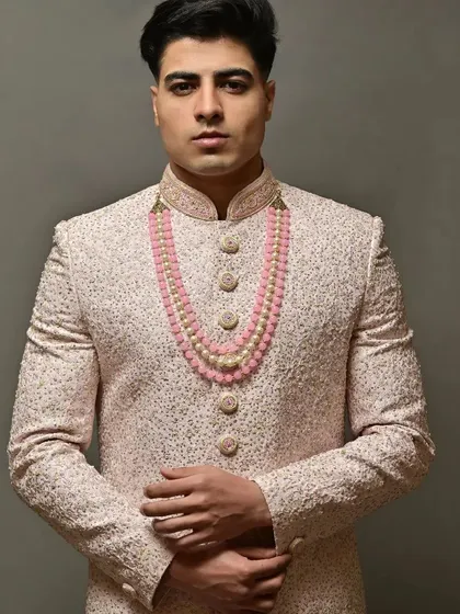 For the grooms who want to look just as stunning. This is a look at one of my pre-loved sherwanis, featuring delicate embroidery and paired with a beautiful pink beaded necklace for a touch of modern royalty.