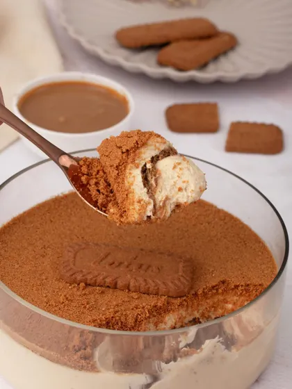 A spoonful of pure indulgence. This close-up captures the creamy, layered texture of our Biscoff Tiramisu, topped with a generous dusting of crunchy Biscoff crumbs. It’s a sensory experience that showcases the quality of ingredients we use in every dessert.