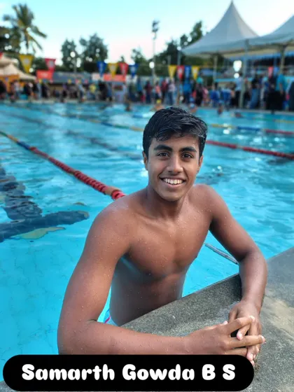 Samarth Gowda B S smiling by the pool after winning bronze.
