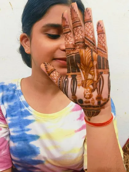 My young client is happy with her Karwa Chauth mehandi. It's always fun to create designs for the younger members of the family too.