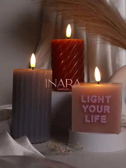 Another look at our new pillar candle collection, showcasing the beautiful ambient light they create. These designs are perfect for home decor and gifting.