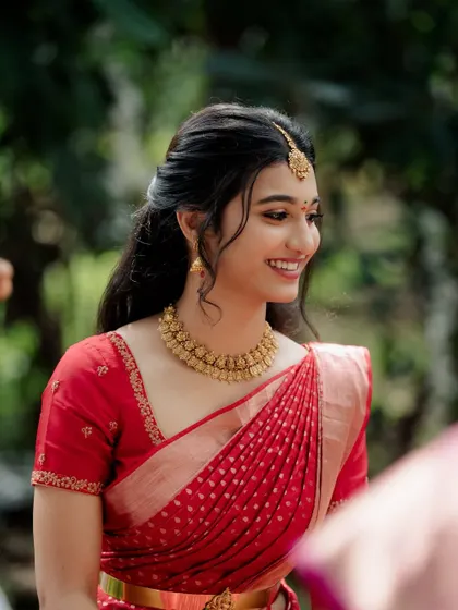 A close-up of the bride-to-be. Her skin looks fresh and dewy, and the makeup enhances her natural features.