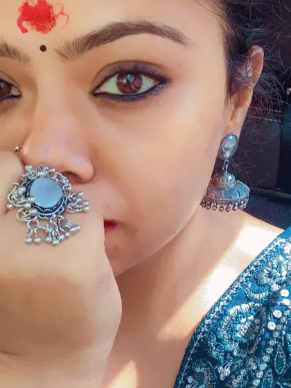 The power of traditional accessories. A silver mirror ring, jhumkas, and a simple bindi create a look that is both spiritual and deeply stylish.
