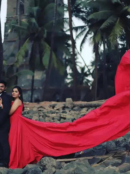 A dramatic pre-wedding shoot with a flowing red gown. The makeup is kept classic and glamorous to match the vibe.