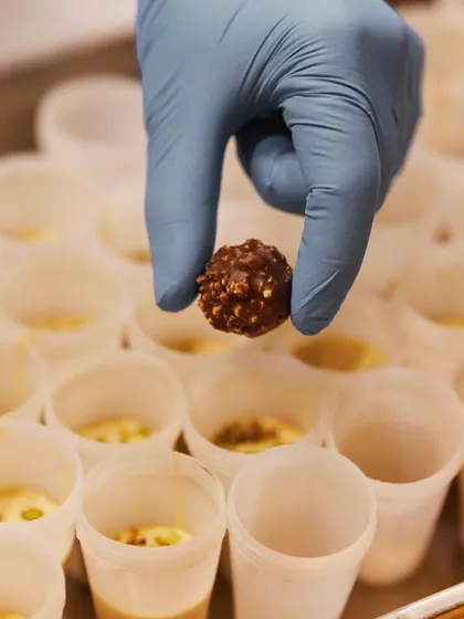 The making of our Salted Chikki Kulfi, with each mould being carefully filled.