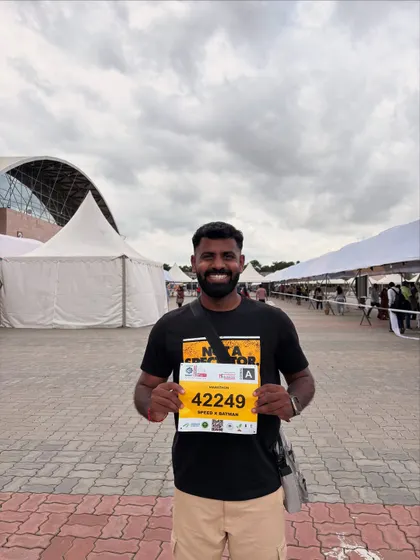 Holding up my bib for my 9th 42.2km race. Hyderabad has a special place in my heart, and I'm ready to take on its streets.