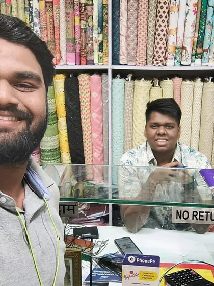 Our team member takes a selfie with a customer in his shop. We provide solar solutions for homes and businesses.