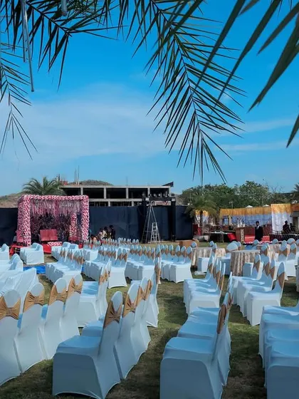 We can transform any large outdoor space into the perfect venue for your destination wedding events. This lawn is set up with organized seating and multiple stages, ready for a day of celebration under the open sky.