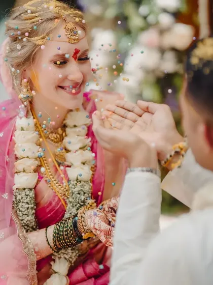 A duplicate of 188, this joyful ceremony shot showcases the bride's radiant smile and her beautiful henna.