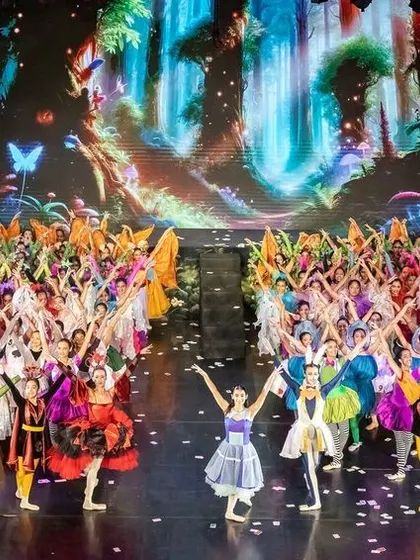 The entire cast of our "Alice" production takes a bow. Staging a show of this magnitude involves coordinating over a hundred dancers, showcasing the depth of our student body and our organizational capacity.