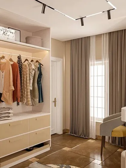A light and airy walk-in closet with open hanging space, drawers, and a separate vanity nook. The natural light from the window makes it a pleasant space to start the day.