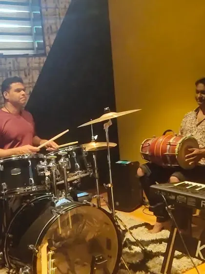 The rhythm section of my band, 27 STAARS, locked in a groove during rehearsals. The drummer, dholak player, and keyboardist are the foundation of our sound.