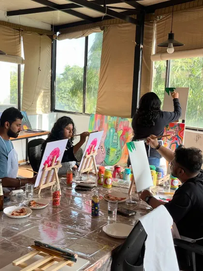 A group of friends enjoying a painting session at our studio. It's a great way to hang out, relax, and do something creative together.