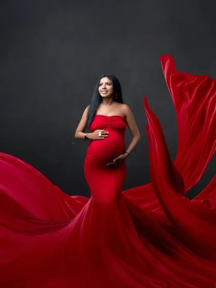 Simple, bold, and beautiful. This portrait focuses on the mother-to-be in a stunning red gown, with the flowing fabric creating a work of art.
