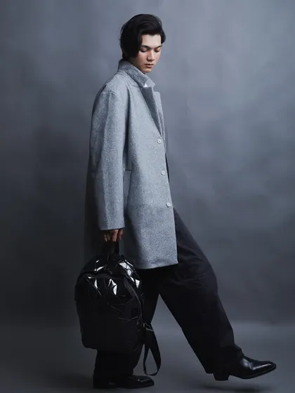 Capturing movement in the studio adds a dynamic element. This shot shows the model in motion, giving a sense of narrative and energy to the fashion portrait.