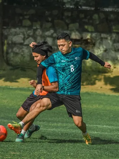 A tough but fair shoulder-to-shoulder challenge for the ball.