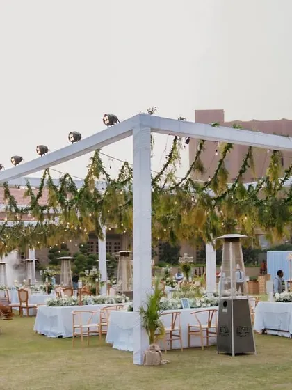 These images and videos provide wider views and different angles of the elegant 'Luxe Garden' reception, showcasing the scale and consistency of the design.